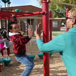Karen high fives boy on playground